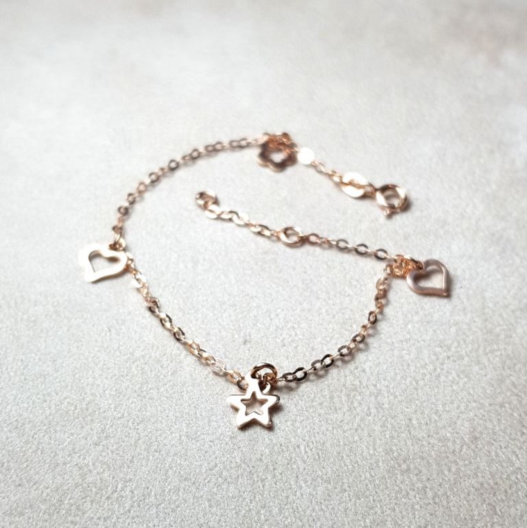 18k red gold bracelet with stars hearts and flowers